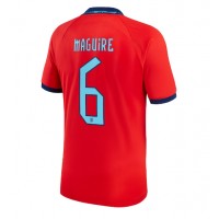 Camisa de Futebol Inglaterra Harry Maguire #6 Equipamento Secundário Mundo 2022 Manga Curta